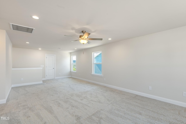 empty room featuring light carpet and ceiling fan