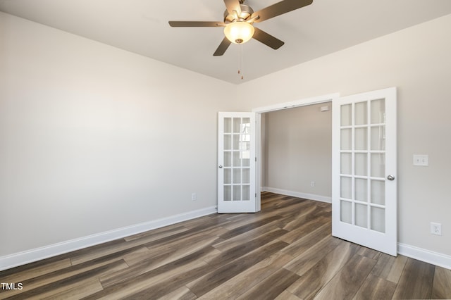 unfurnished room with ceiling fan, dark hardwood / wood-style flooring, and french doors