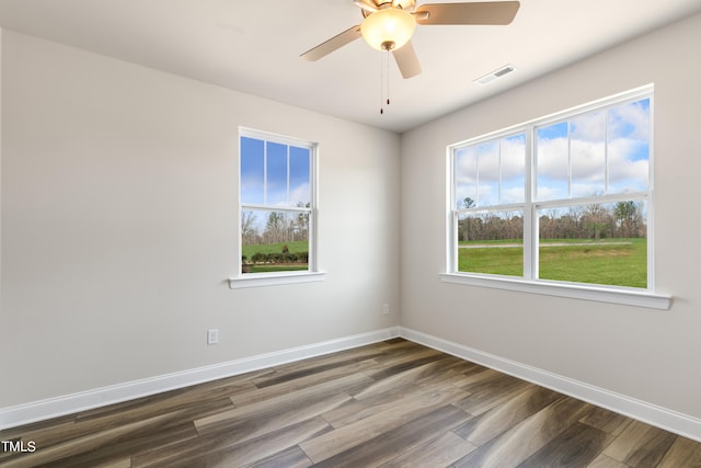 spare room featuring wood-type flooring and ceiling fan