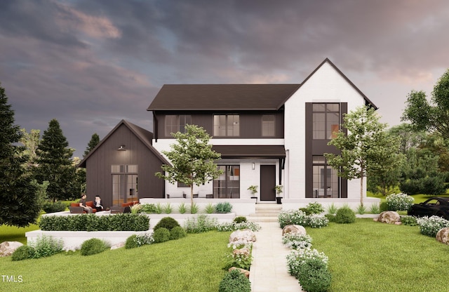 view of front facade featuring outdoor lounge area, a front lawn, and brick siding