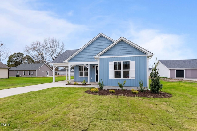 view of front of property with a front lawn and a carport