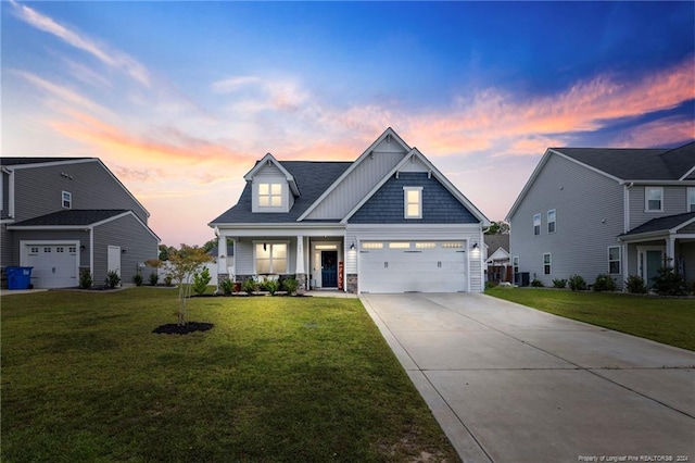 craftsman inspired home with a porch, a yard, and a garage