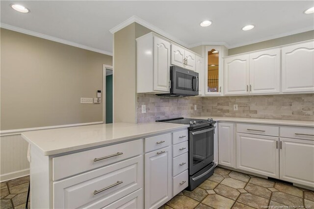 kitchen featuring light countertops, white cabinetry, a peninsula, and stainless steel electric stove