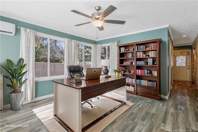 office space with crown molding, baseboards, wood finished floors, and a wall mounted AC