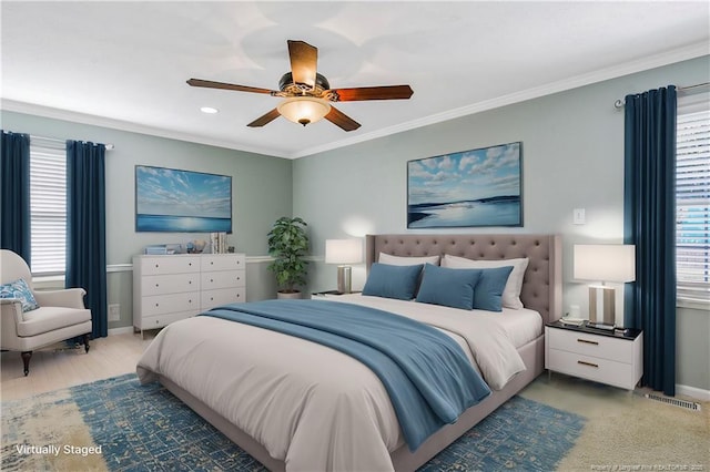 bedroom featuring ornamental molding, visible vents, baseboards, and a ceiling fan