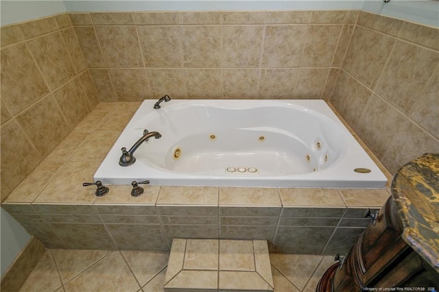 bathroom with a whirlpool tub and tile patterned floors