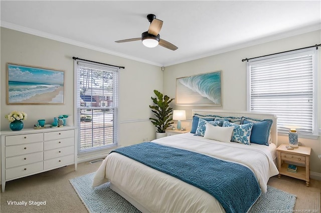 bedroom featuring light carpet, visible vents, a ceiling fan, and ornamental molding