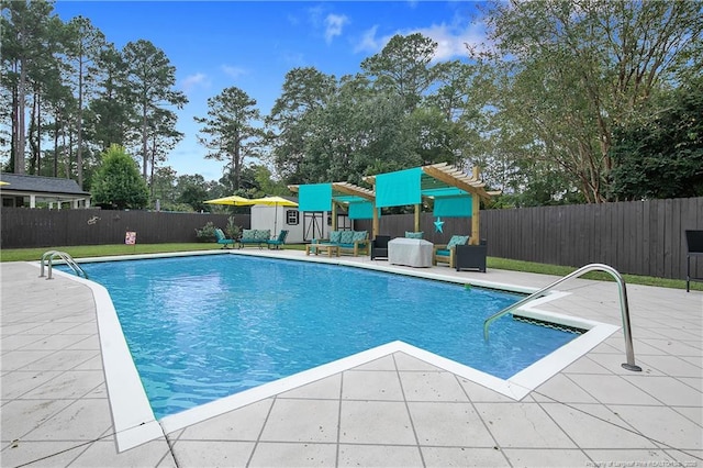 view of pool featuring a patio area, fence, and a fenced in pool