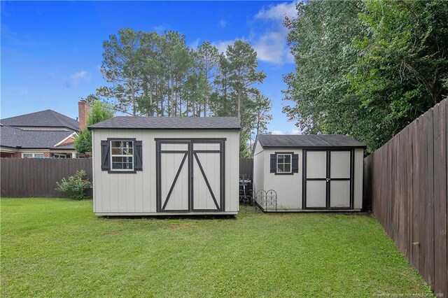 view of shed featuring a fenced backyard