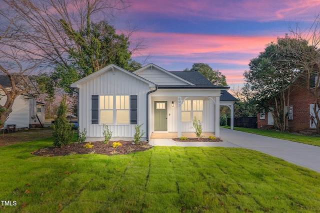 view of front of property with a yard