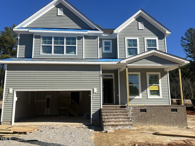 view of front of property featuring a garage and covered porch