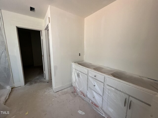 bathroom with concrete floors