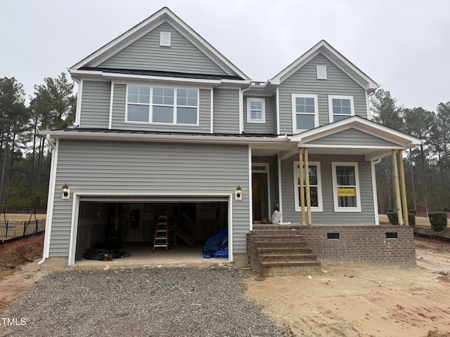 135 Green Haven Blvd Lot # 1, Youngsville, NC 27596 - view of front facade featuring crawl space, fence, a porch, a garage, and gravel driveway