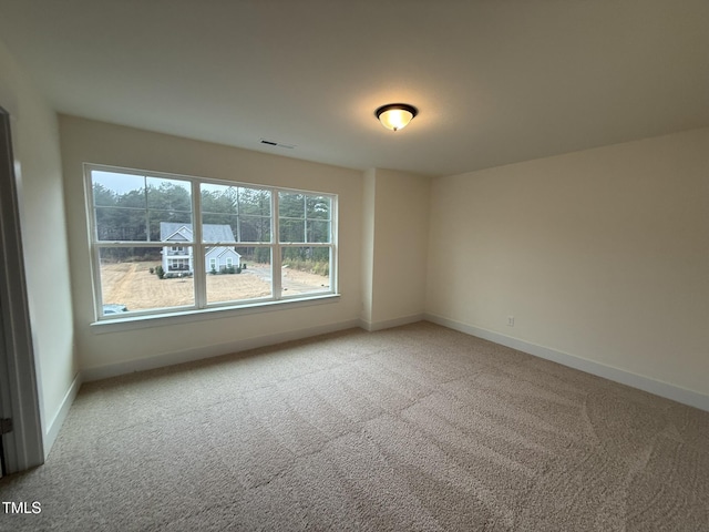 unfurnished room featuring carpet floors