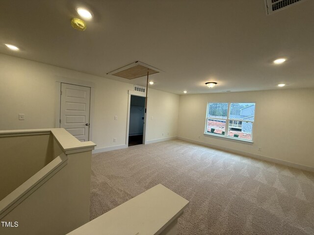 basement with light colored carpet