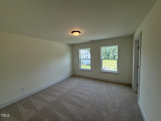 135 Green Haven Blvd Lot # 1, Youngsville, NC 27596 - empty room with light carpet and baseboards