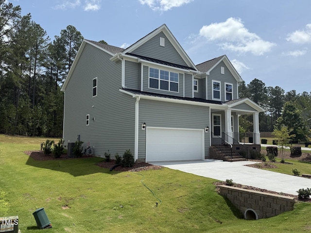 135 Green Haven Blvd Lot # 1, Youngsville, NC 27596 - craftsman-style house with an attached garage, concrete driveway, a standing seam roof, metal roof, and a front lawn