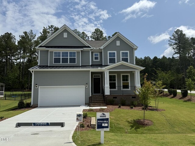 135 Green Haven Blvd Lot # 1, Youngsville, NC 27596 - craftsman-style house featuring a standing seam roof, an attached garage, a porch, concrete driveway, and metal roof