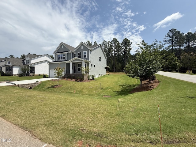 135 Green Haven Blvd Lot # 1, Youngsville, NC 27596 - view of front facade featuring an attached garage, concrete driveway, and a front lawn