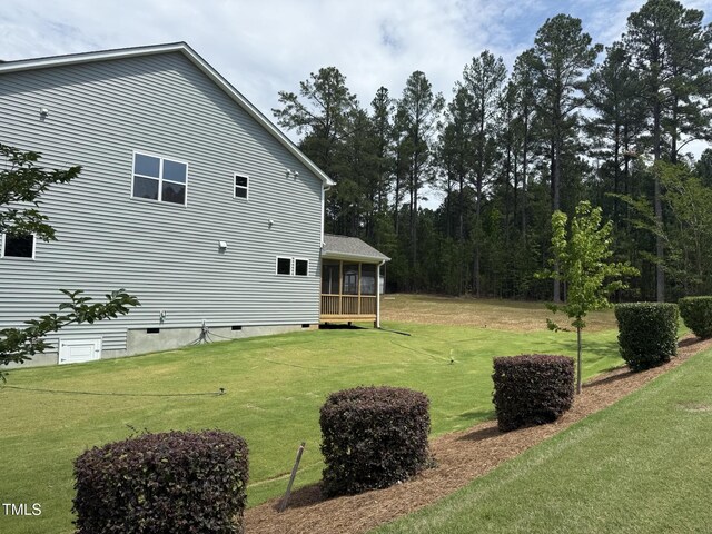 135 Green Haven Blvd Lot # 1, Youngsville, NC 27596 - view of grassy yard featuring a sunroom