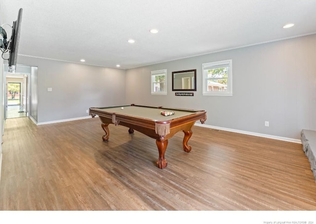 recreation room featuring light wood-type flooring, a textured ceiling, and billiards