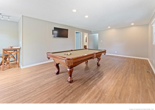 recreation room featuring billiards, a textured ceiling, and light wood-type flooring