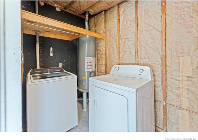 washroom featuring washing machine and clothes dryer and water heater