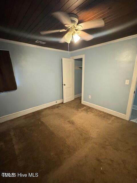 unfurnished bedroom with carpet floors, ceiling fan, and ornamental molding