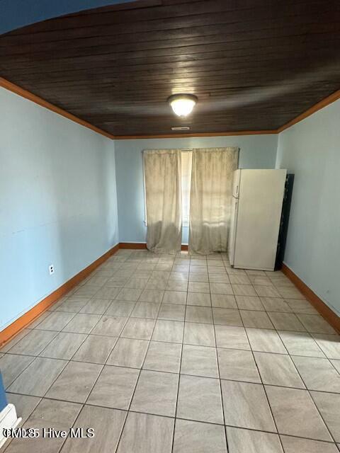 unfurnished room featuring ornamental molding and wooden ceiling