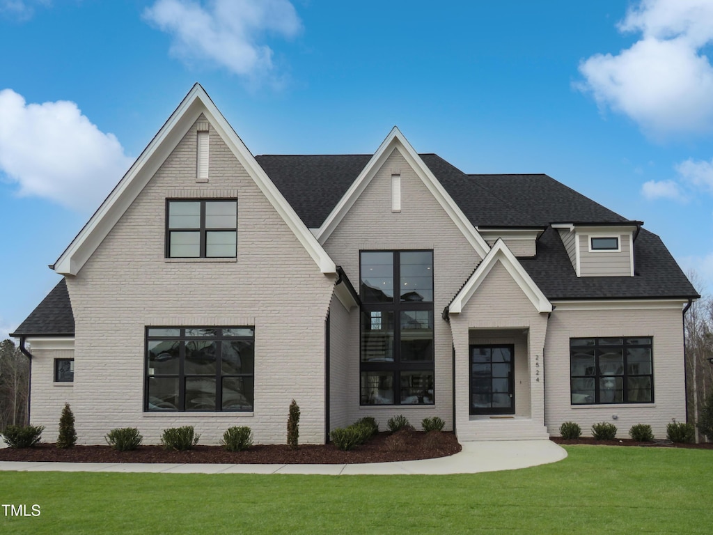 view of front of property with a front lawn