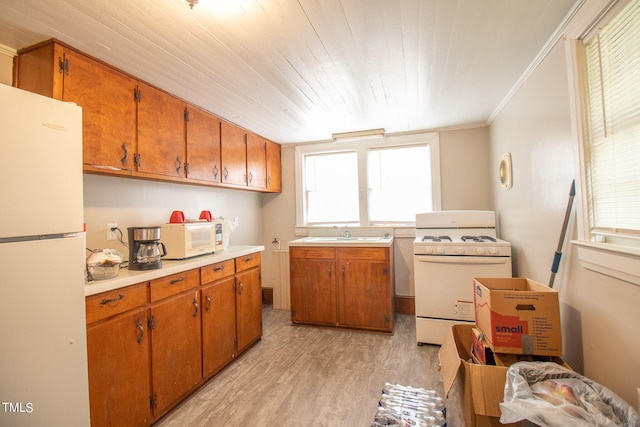 kitchen featuring light hardwood / wood-style floors, white appliances, wooden ceiling, ornamental molding, and sink