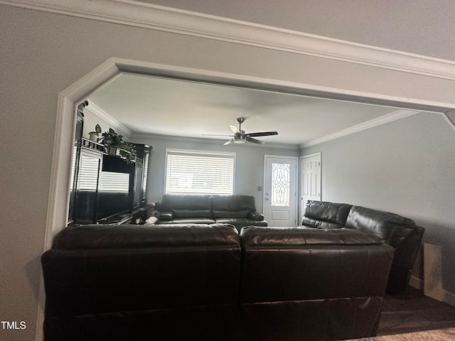 living room featuring ceiling fan, hardwood / wood-style floors, and ornamental molding