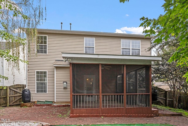 back of property featuring a sunroom