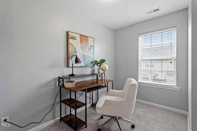 office space featuring light carpet and a wealth of natural light