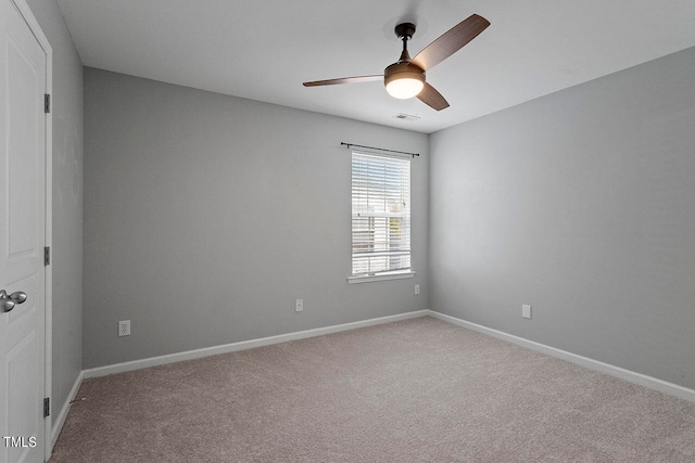 carpeted empty room with ceiling fan