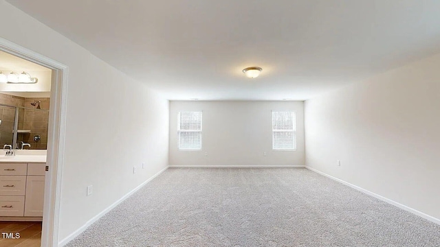 empty room featuring light colored carpet