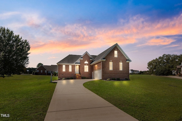 view of front facade featuring a lawn and a garage