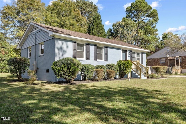 ranch-style house with a front lawn