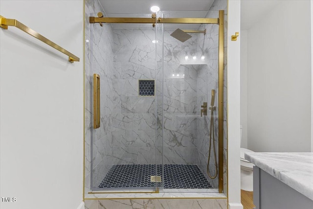 bathroom featuring a shower with shower door