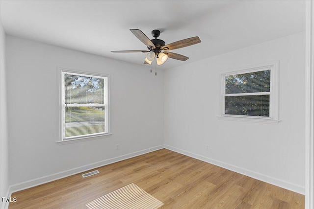 empty room featuring light hardwood / wood-style floors and ceiling fan