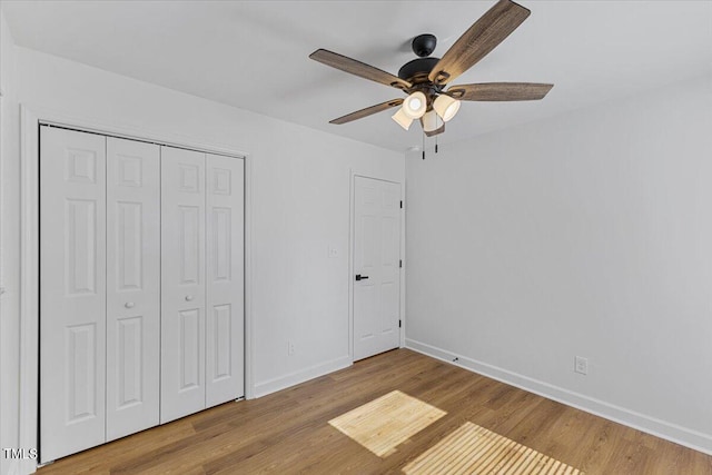 unfurnished bedroom with a closet, ceiling fan, and light hardwood / wood-style floors