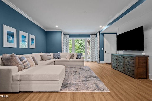 living room featuring wood-type flooring and ornamental molding