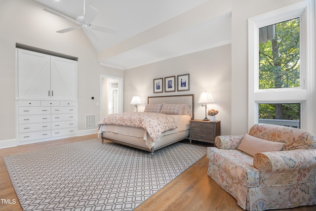 bedroom featuring vaulted ceiling, hardwood / wood-style flooring, and ceiling fan