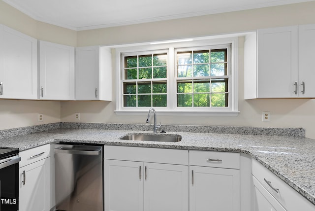 kitchen featuring light stone countertops, white cabinetry, sink, and stainless steel appliances