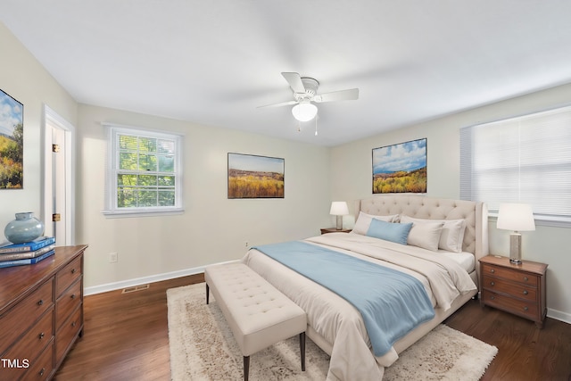 bedroom featuring ceiling fan and dark hardwood / wood-style flooring