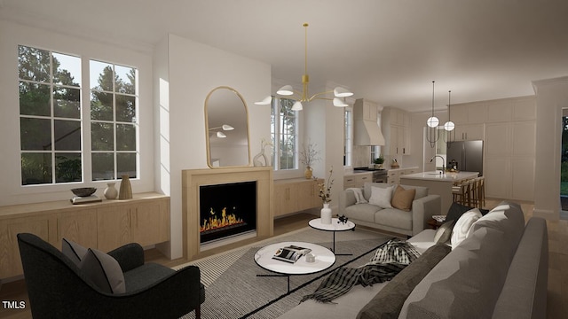 living room with an inviting chandelier and sink