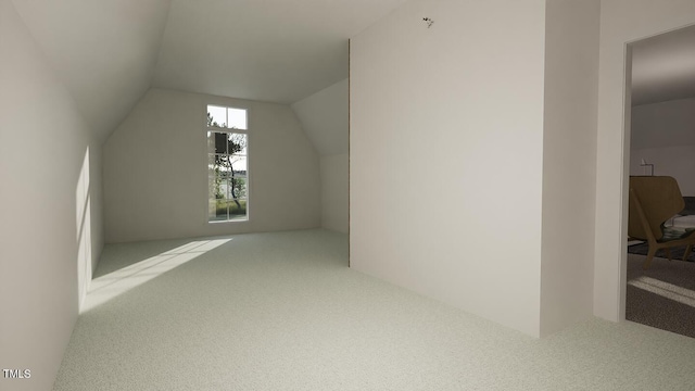 bonus room with lofted ceiling and carpet