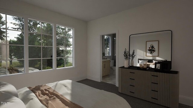 3301 Dell Dr, Raleigh, NC 27609 - carpeted bedroom featuring ensuite bath and baseboards