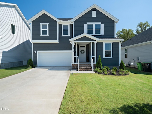 view of front facade with a garage and a front lawn