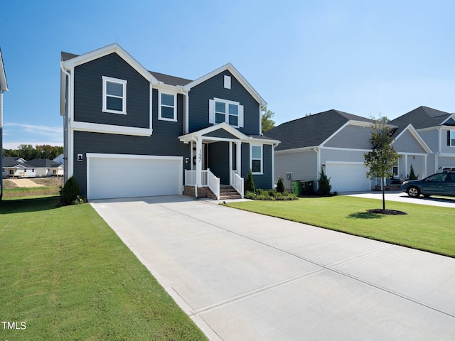 view of front of house with a front lawn and a garage